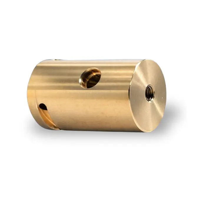 Precision-turned cylindrical brass bushing component featuring a cross-drilled hole and smooth chamfered edges.