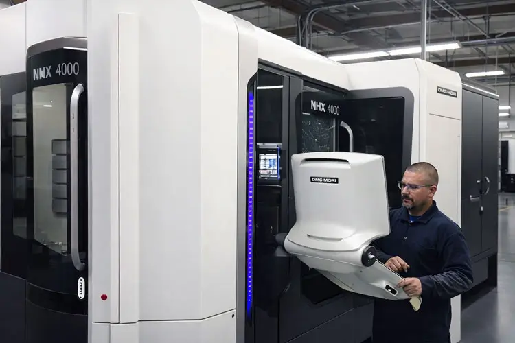 High-speed DMG MORI NHX 4000 horizontal machining center cutting precision components.
